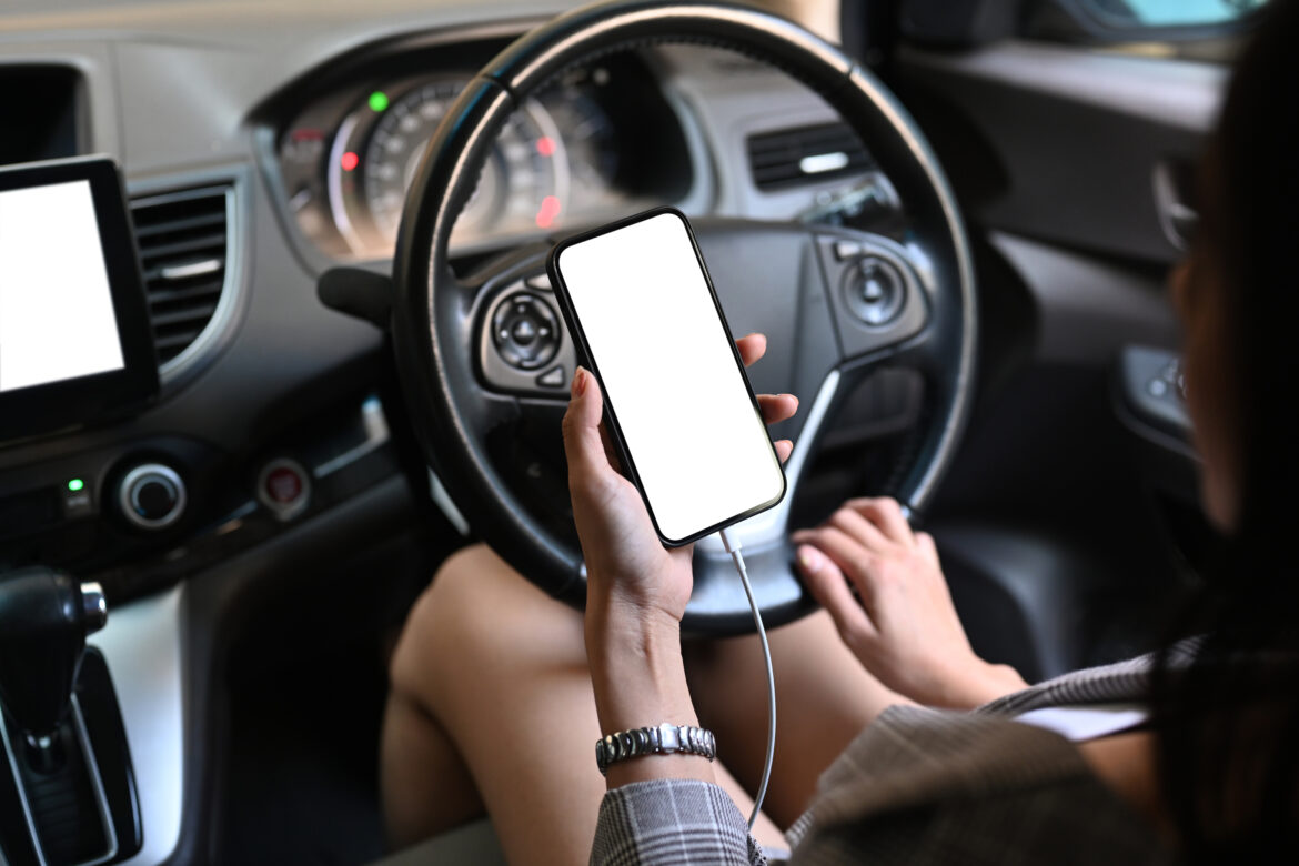 The Dangers of Driving While Using a Phone